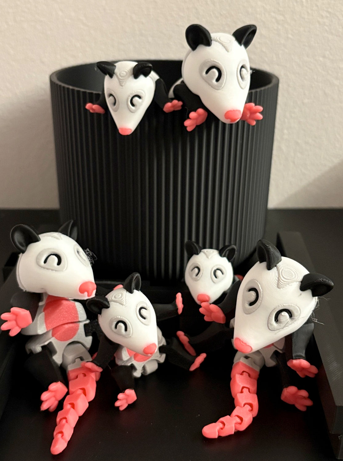 Articulated Possums in a Trash Can